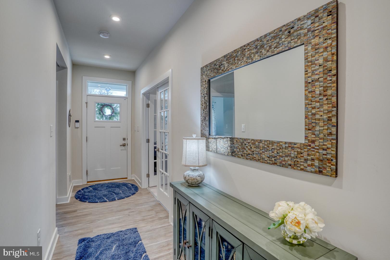 24077 Caldwell Circle Lewes, DE 19958 - Photo 11 of 60 a living room with furniture and a table