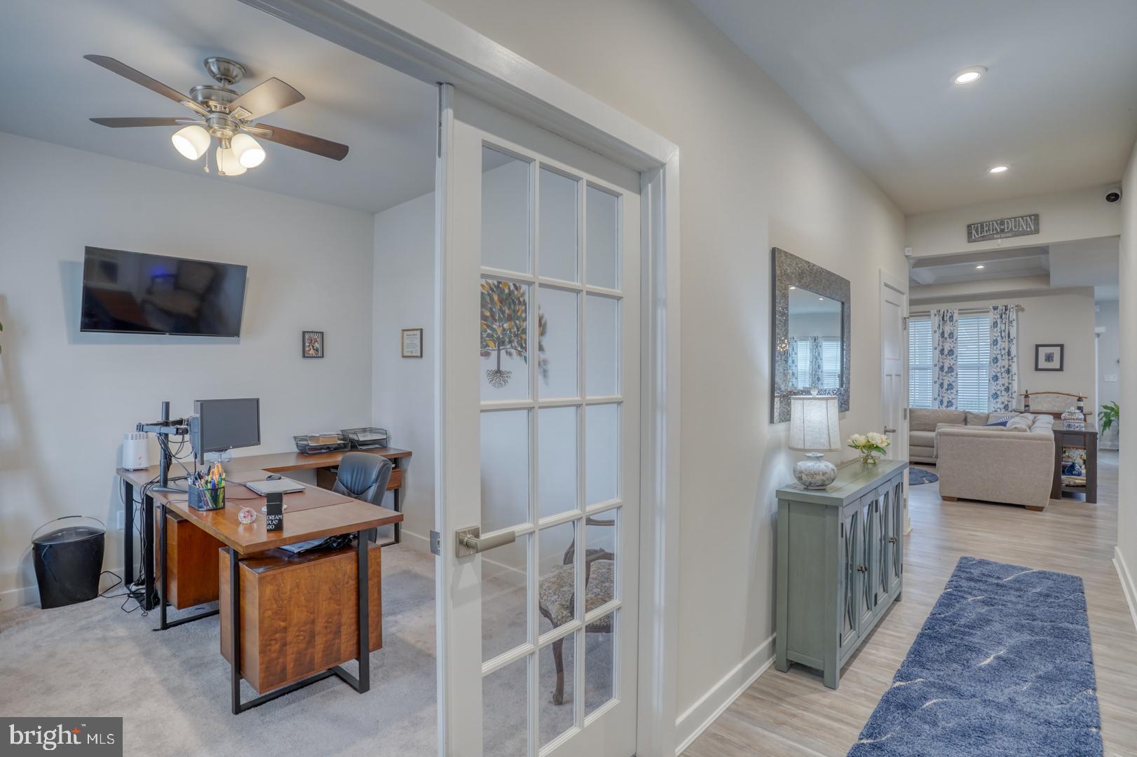 24077 Caldwell Circle Lewes, DE 19958 - Photo 12 of 60 a living room with furniture and a flat screen tv