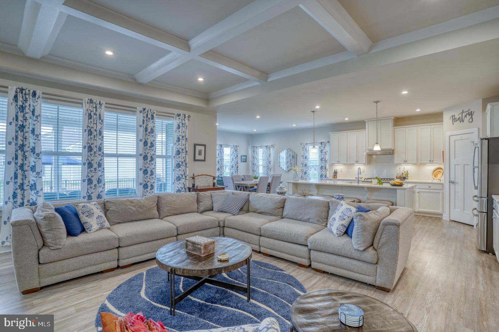 24077 Caldwell Circle Lewes, DE 19958 - Photo 23 of 60 a living room with furniture and a large window