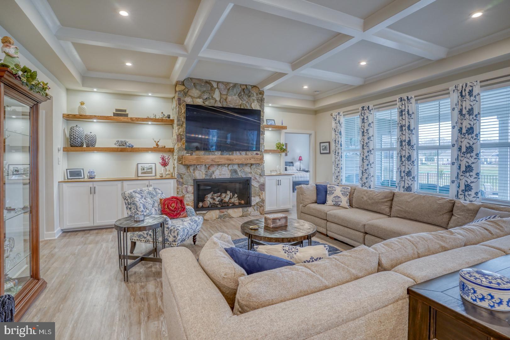 24077 Caldwell Circle Lewes, DE 19958 - Photo 25 of 60 a living room with furniture a fireplace and a flat screen tv