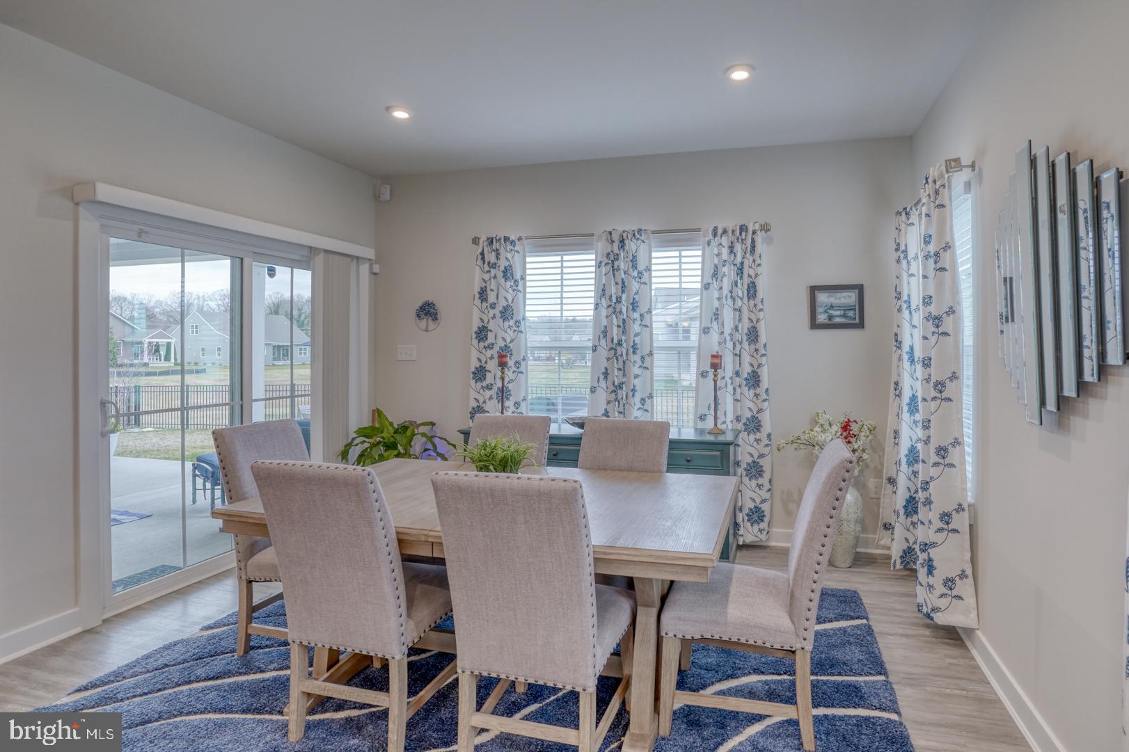 24077 Caldwell Circle Lewes, DE 19958 - Photo 28 of 60 a view of a dining room with furniture window and wooden floor
