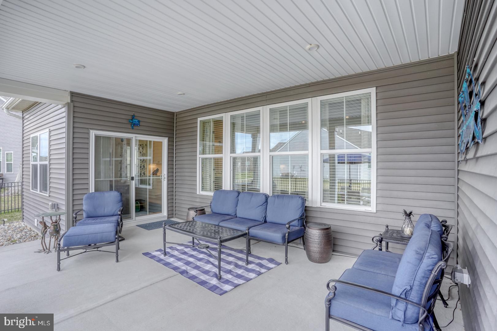 24077 Caldwell Circle Lewes, DE 19958 - Photo 29 of 60 a outdoor living space with furniture and a window