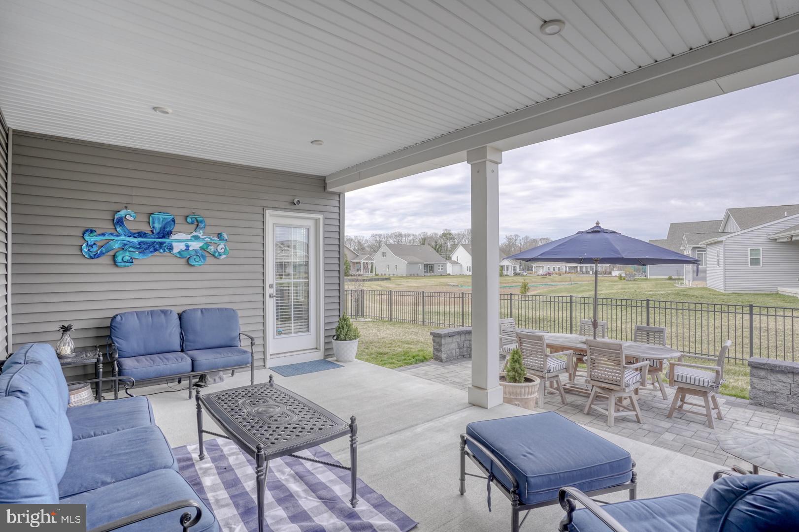 24077 Caldwell Circle Lewes, DE 19958 - Photo 30 of 60 a living room with furniture and a large window