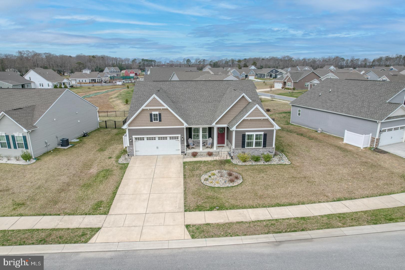 24077 Caldwell Circle Lewes, DE 19958 - Photo 3 of 60 an aerial view of a house with a garden