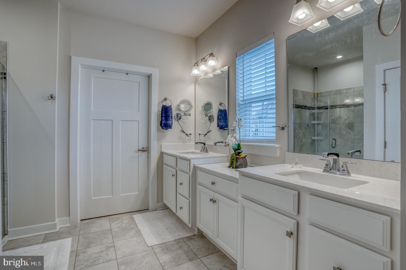 24077 Caldwell Circle Lewes, DE 19958 - Photo 34 of 60 a bathroom with a sink double vanity and a mirror