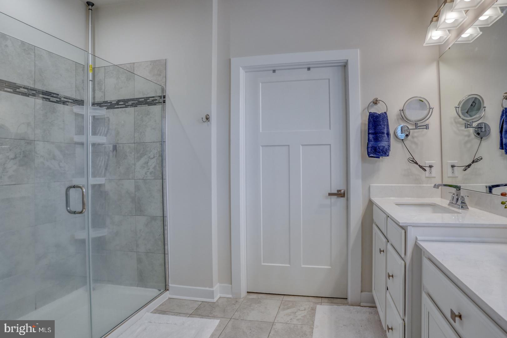 24077 Caldwell Circle Lewes, DE 19958 - Photo 35 of 60 a bathroom with a sink and mirror