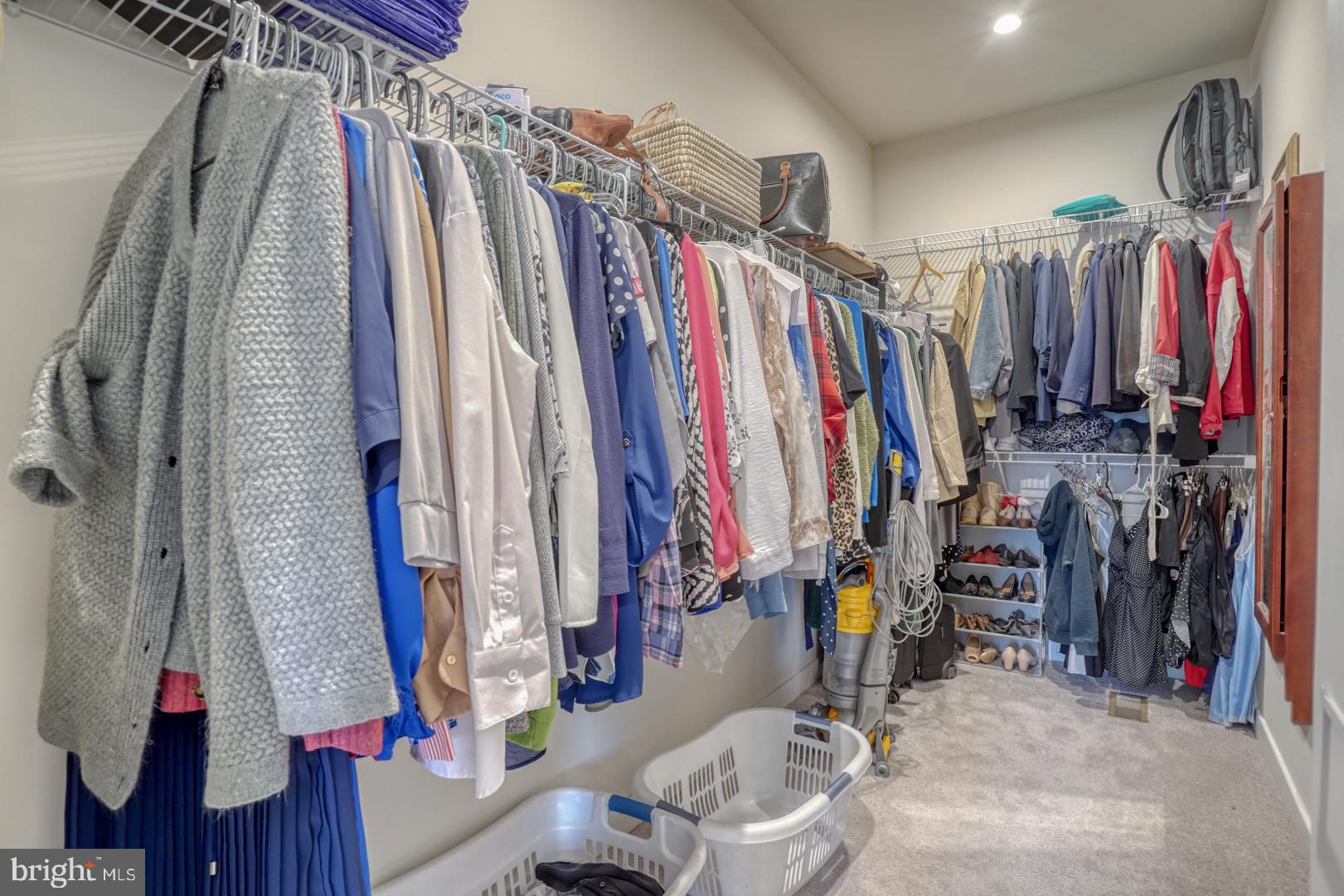 24077 Caldwell Circle Lewes, DE 19958 - Photo 36 of 60 a view of walk in closet with clothes