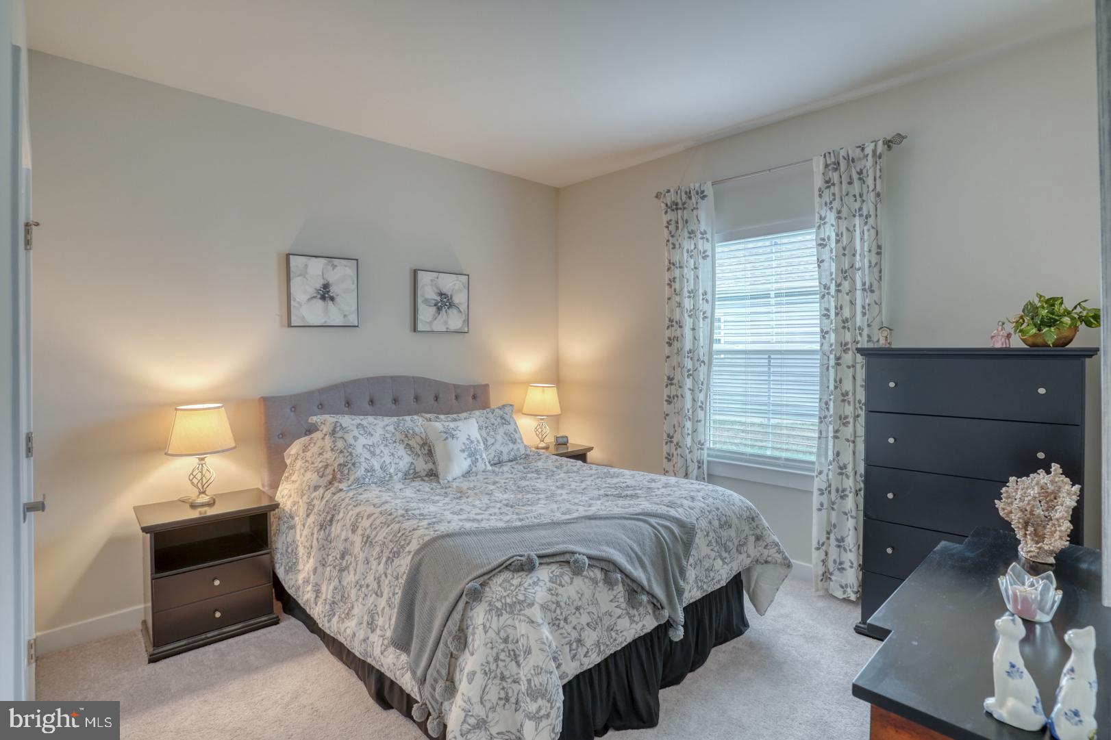 24077 Caldwell Circle Lewes, DE 19958 - Photo 37 of 60 a bedroom with a bed and a window