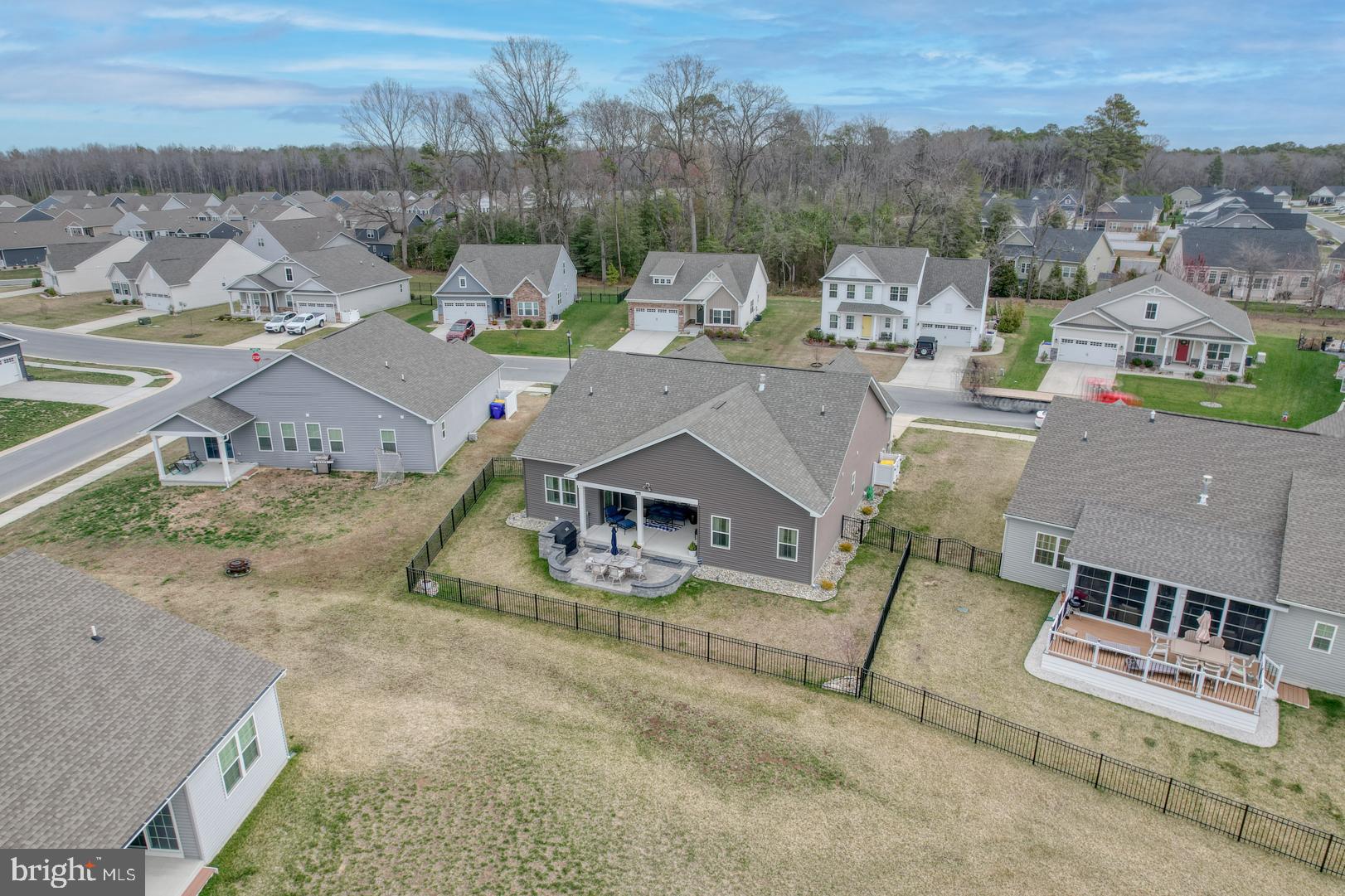 24077 Caldwell Circle Lewes, DE 19958 - Photo 4 of 60 an aerial view of a house with a garden