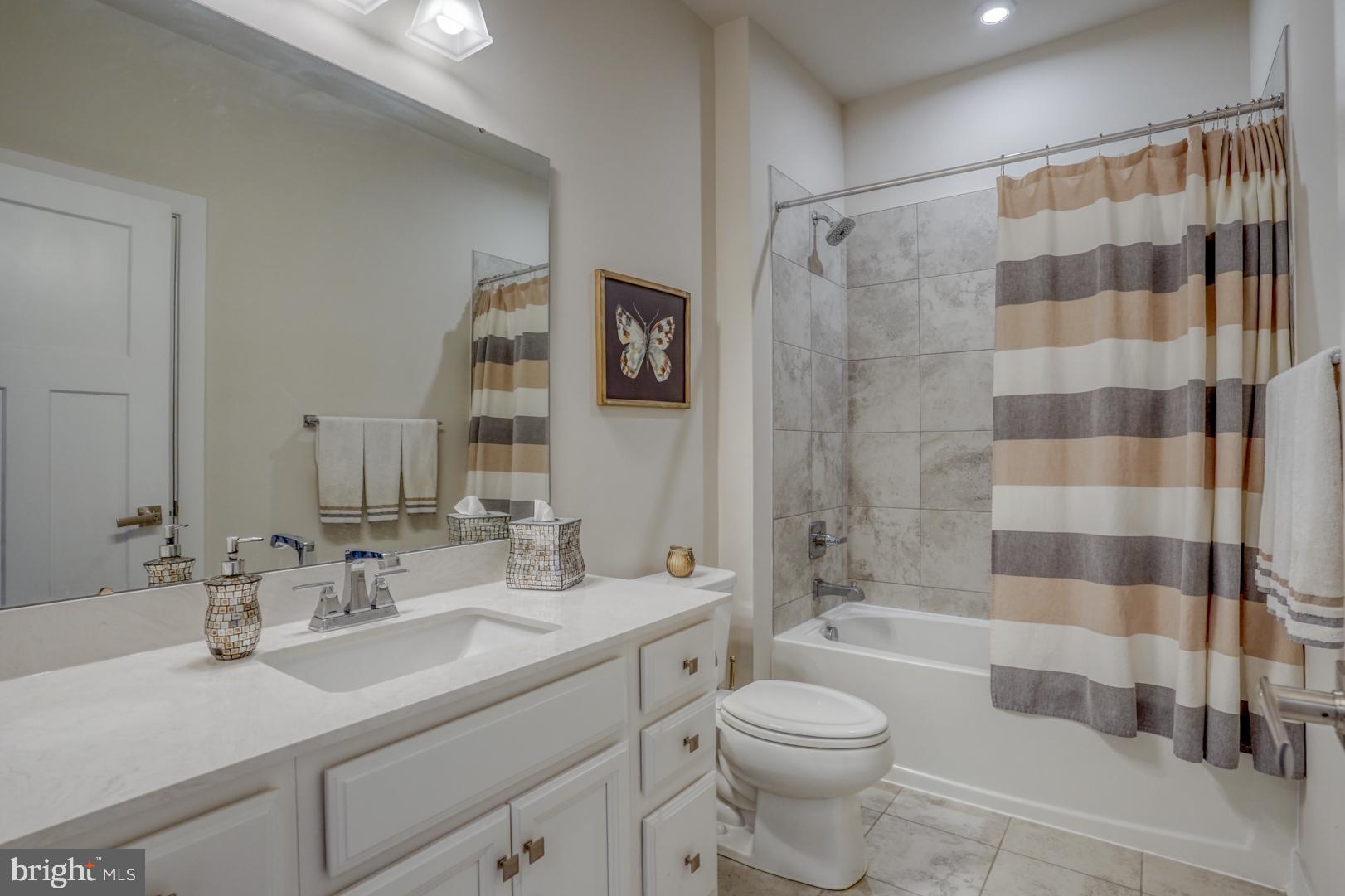 24077 Caldwell Circle Lewes, DE 19958 - Photo 41 of 60 a bathroom with a sink a toilet and shower