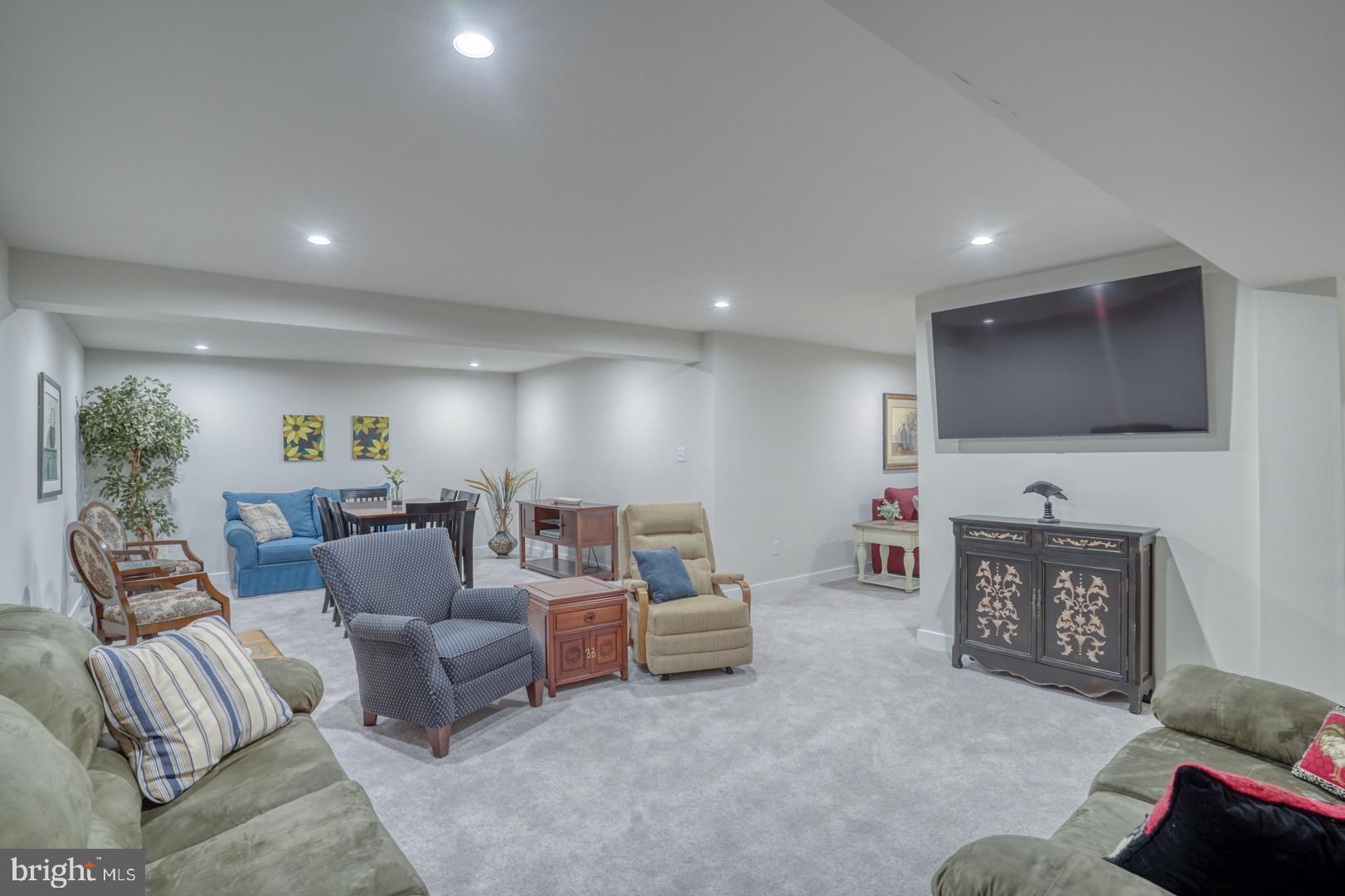 24077 Caldwell Circle Lewes, DE 19958 - Photo 44 of 60 a living room with furniture and a flat screen tv