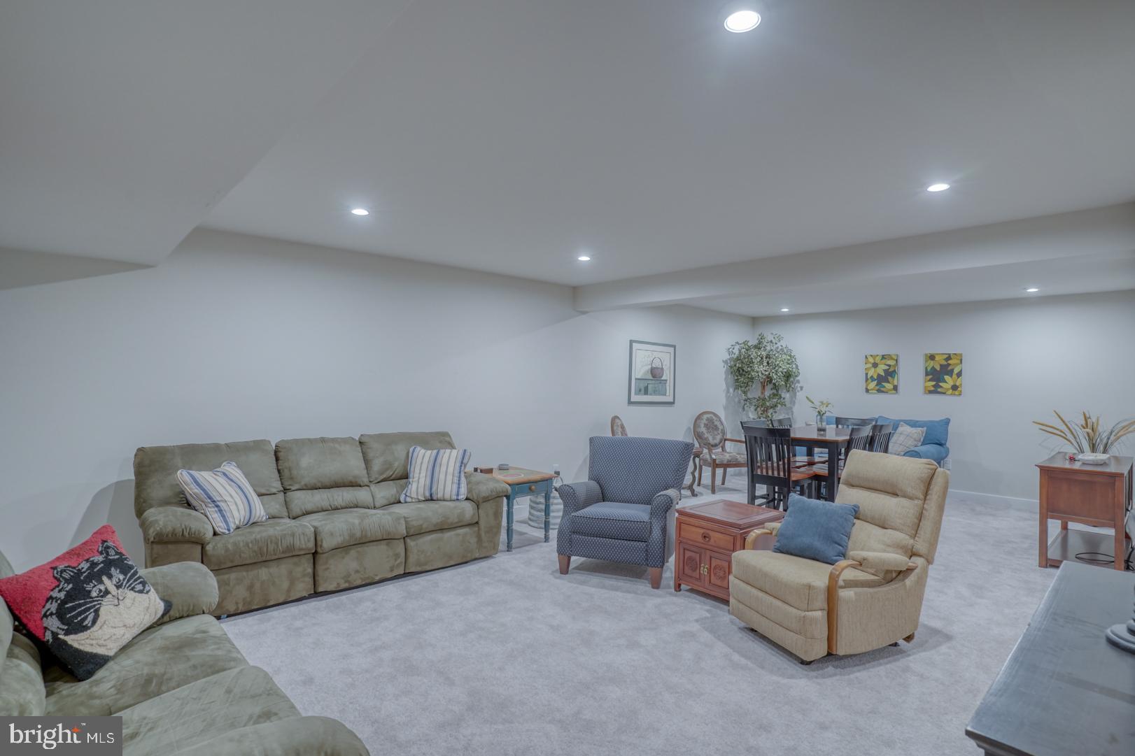 24077 Caldwell Circle Lewes, DE 19958 - Photo 45 of 60 a living room with furniture and a wooden floor