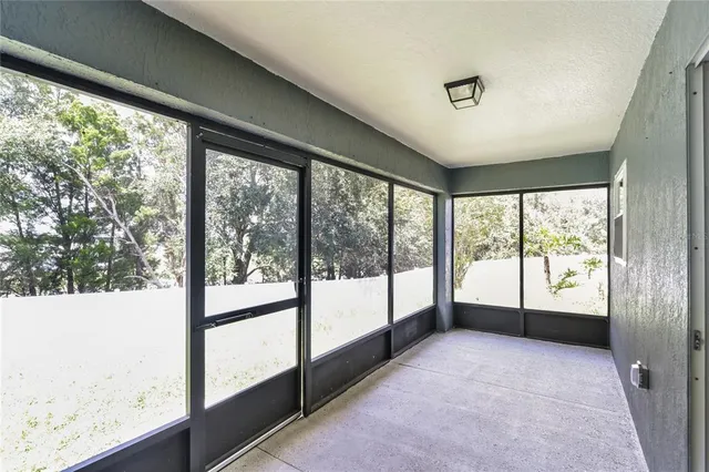 a view of an empty room with a large window