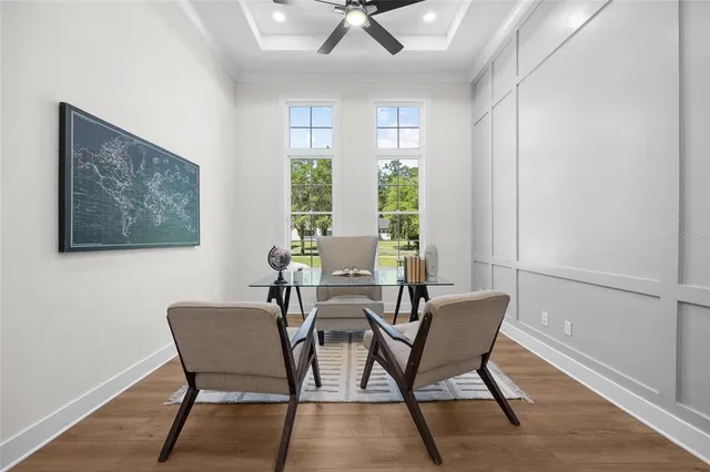 a view of a dining room with furniture window and wooden floor