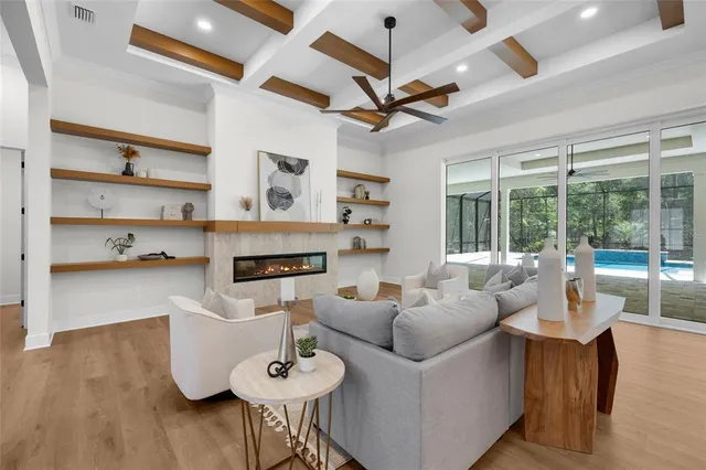 a living room with furniture fireplace and a flat screen tv