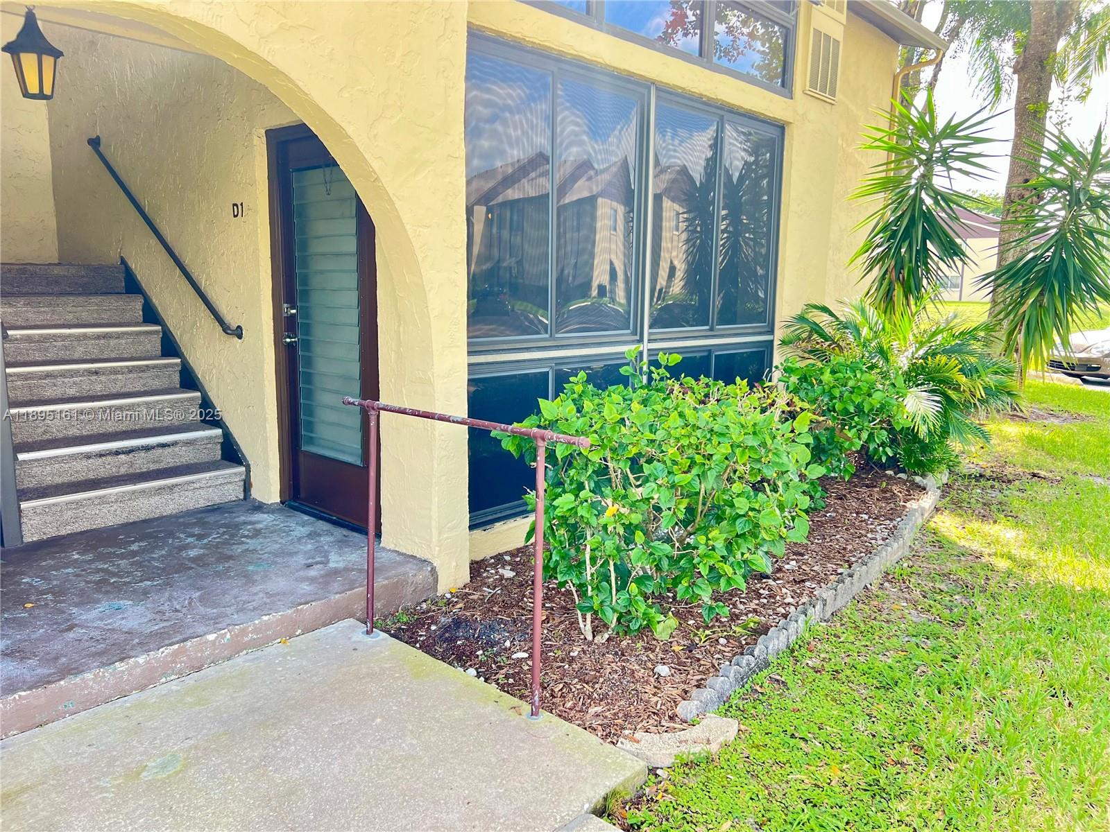 340 Pine Ridge Circle, Unit D1 Greenacres, FL 33463 - Photo 1 of 25 a view of a house with a street