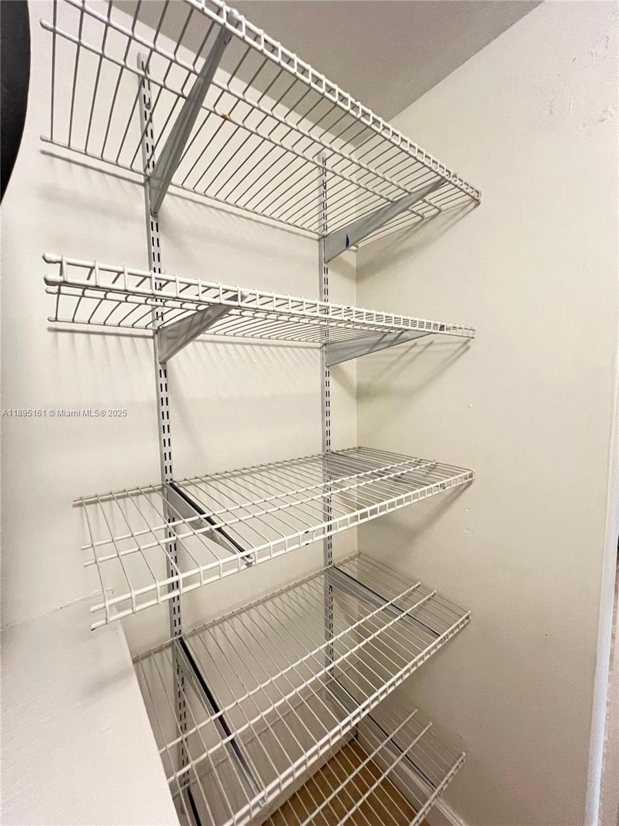 340 Pine Ridge Circle, Unit D1 Greenacres, FL 33463 - Photo 14 of 25 a view of a room with shelves