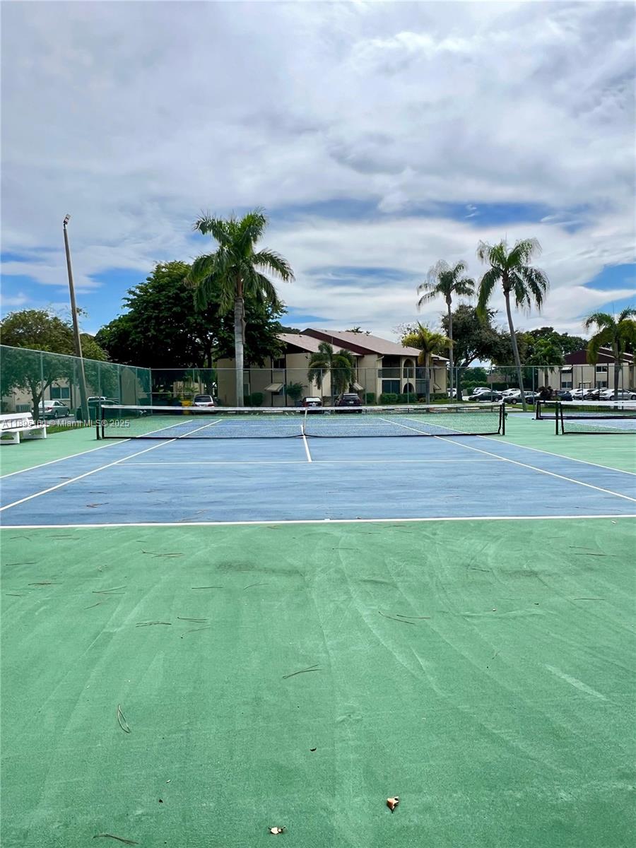 340 Pine Ridge Circle, Unit D1 Greenacres, FL 33463 - Photo 22 of 25 a view of basketball court