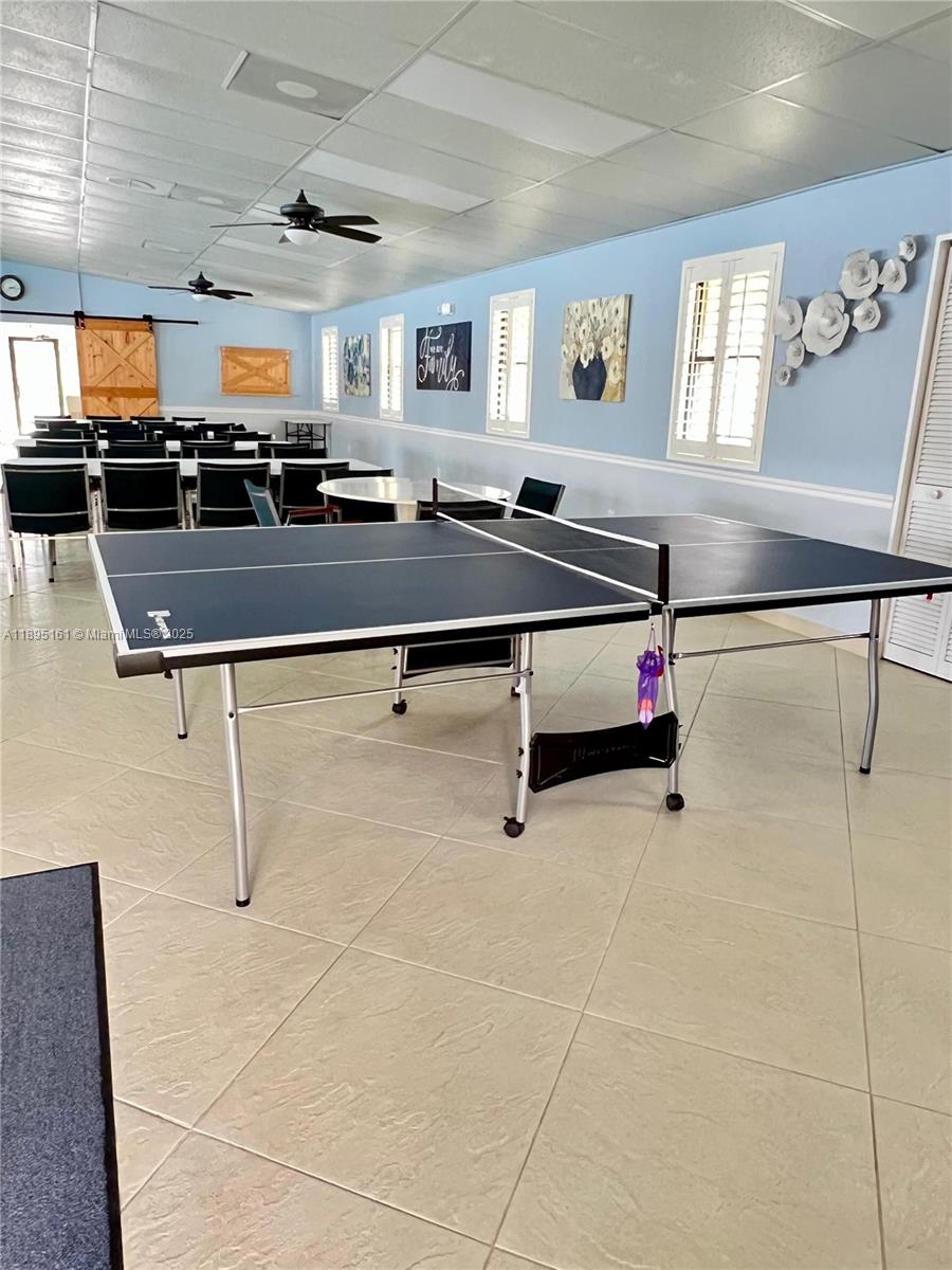 340 Pine Ridge Circle, Unit D1 Greenacres, FL 33463 - Photo 24 of 25 a locker room with kitchen view