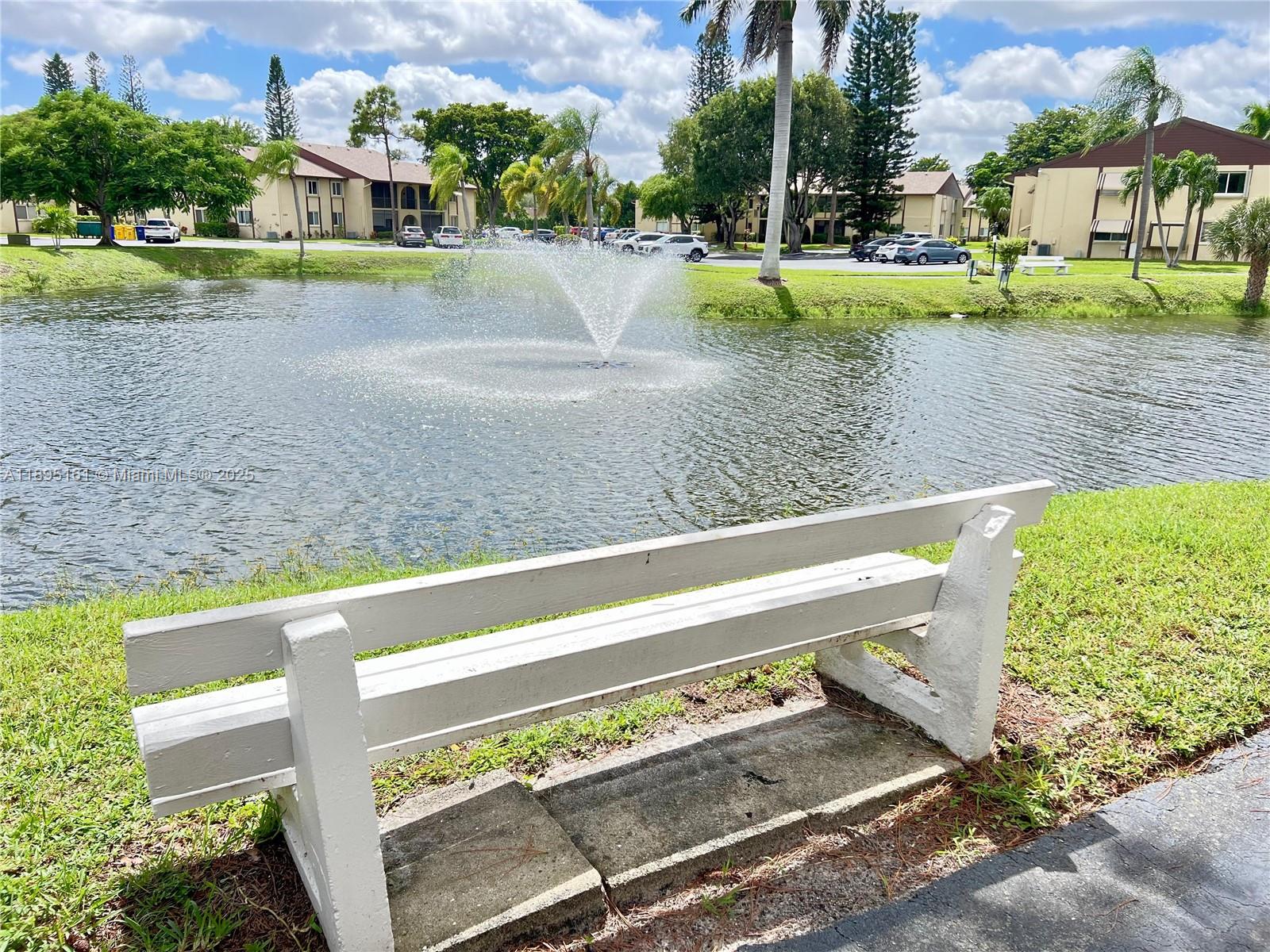 340 Pine Ridge Circle, Unit D1 Greenacres, FL 33463 - Photo 4 of 25 a view of a park with large trees
