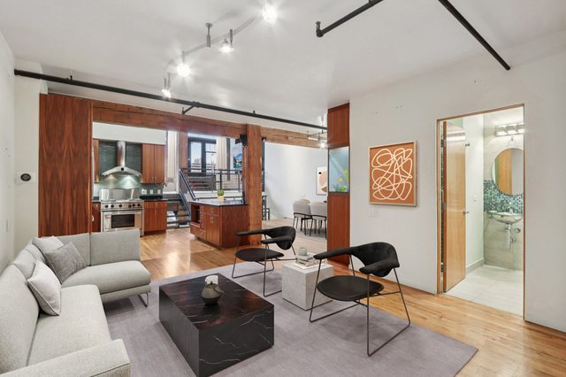 1000 West Washington Boulevard, Unit 137 Chicago, IL 60607 - Photo 10 of 33 a living room with furniture and a large window