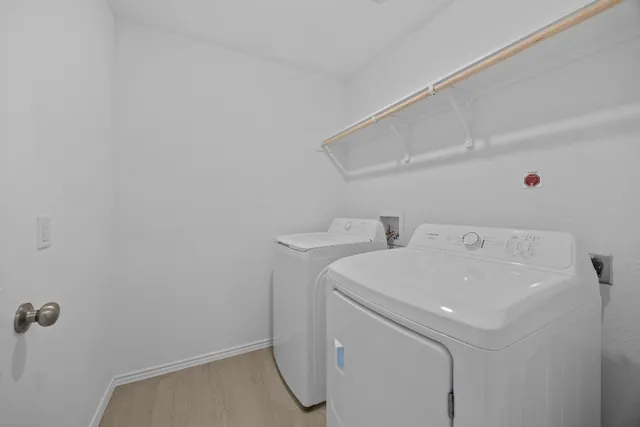a utility room with dryer and washer