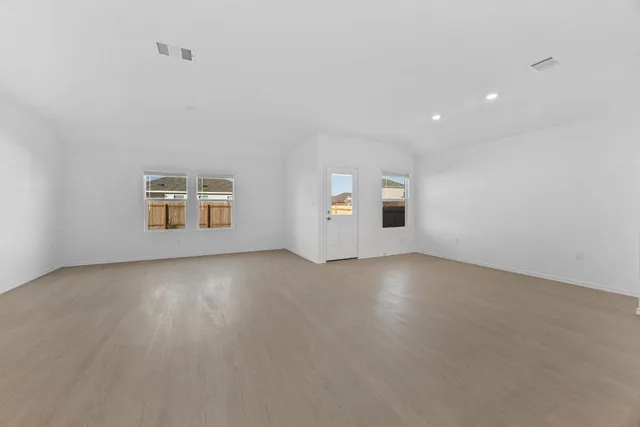 a kitchen with cabinets and stainless steel appliances