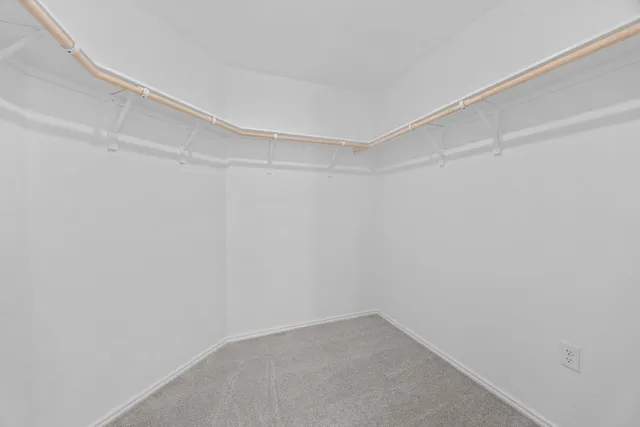 a bathroom with double sink and a mirror