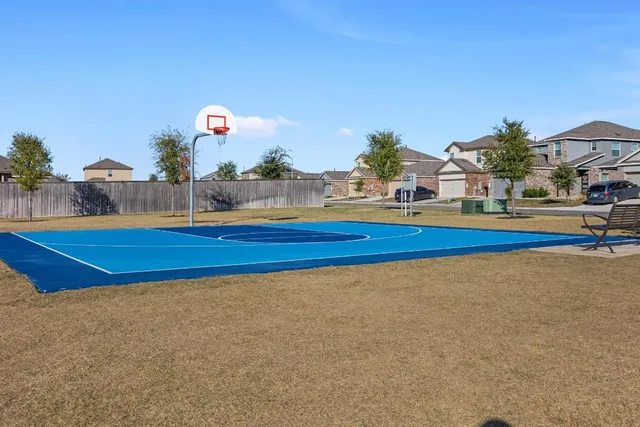 a view of a swimming pool with chairs