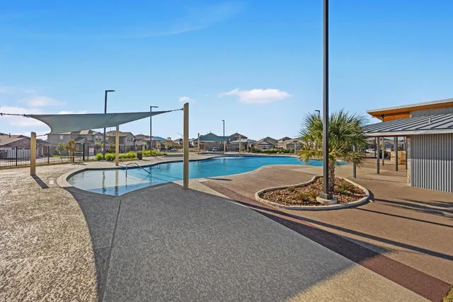 a patio with a yard table and chairs