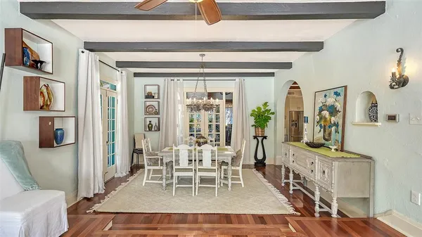 a kitchen with a stove a sink and a window