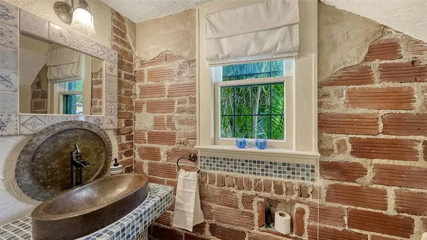 a view of a chairs and table in the patio