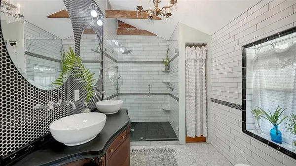 a bathroom with a sink and a window