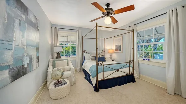 a bedroom with furniture and a window