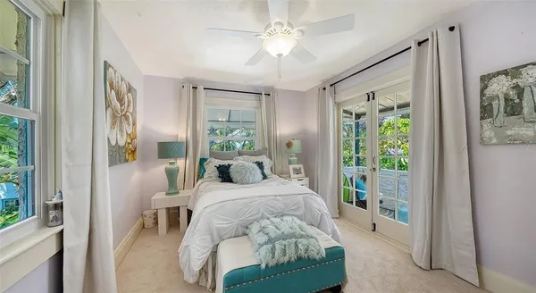 a bed room with a bed window and a chair