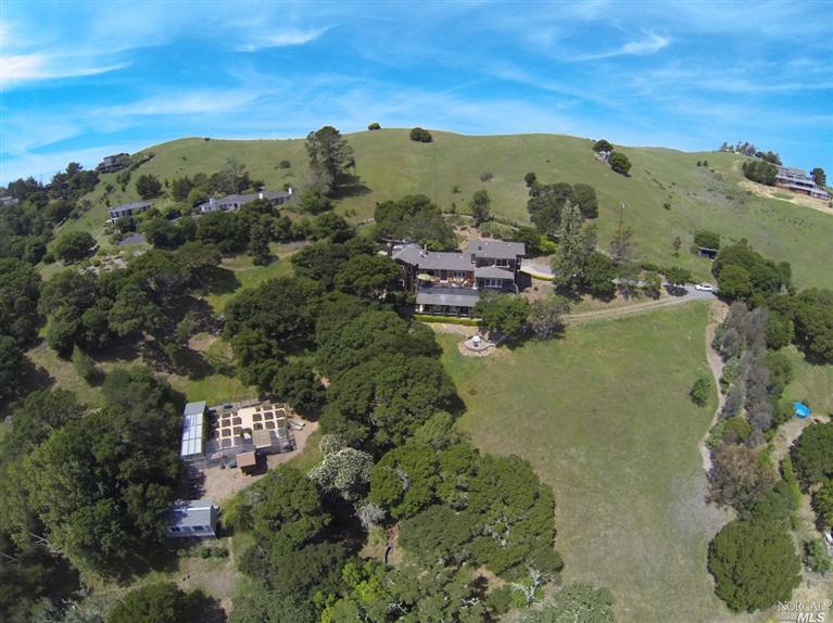 an aerial view of a houses with a lake view