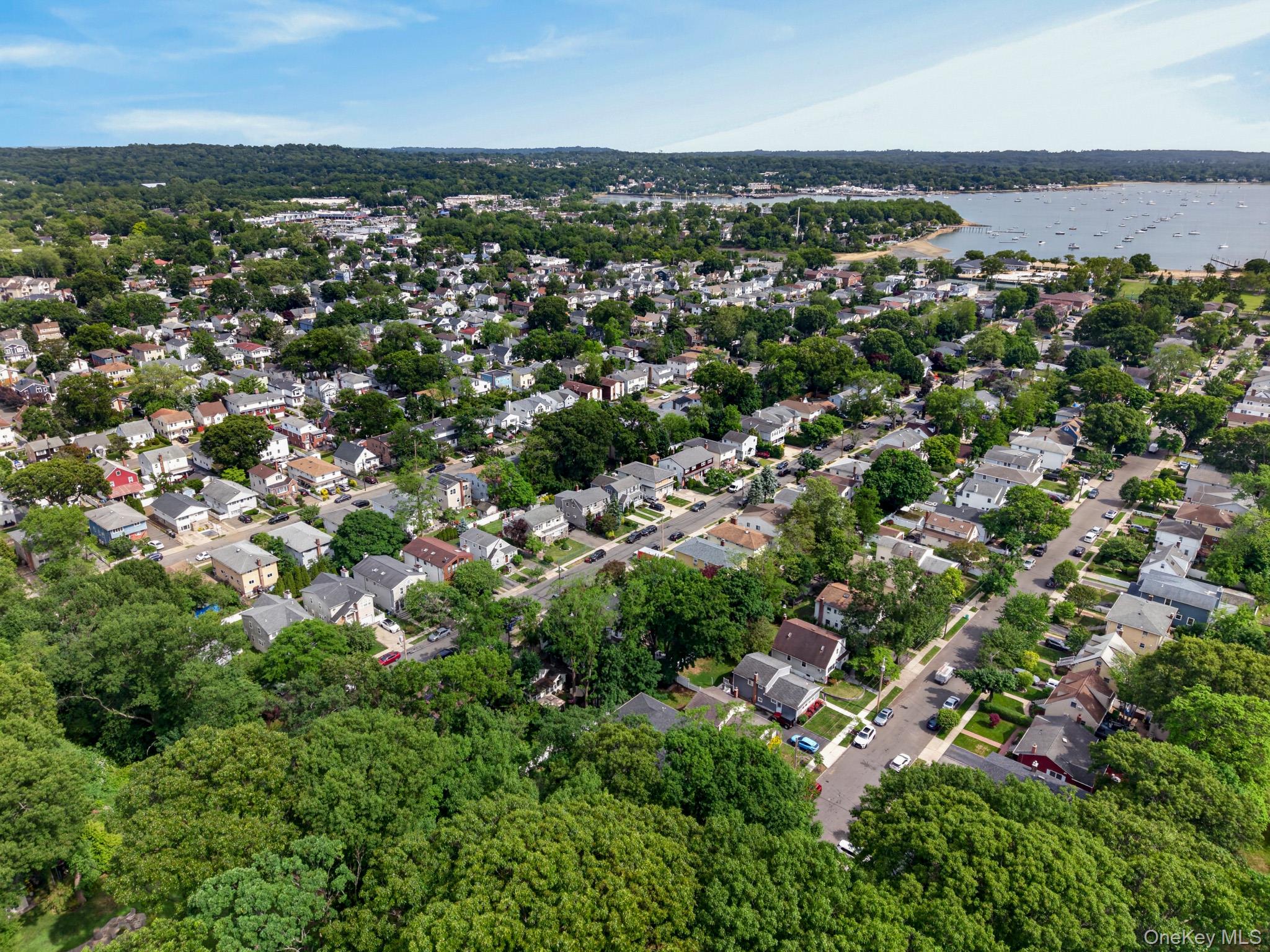 82 B Inwood Road Port Washington, NY 11050 - Photo 40 of 41 an aerial view of a city with lots of residential buildings