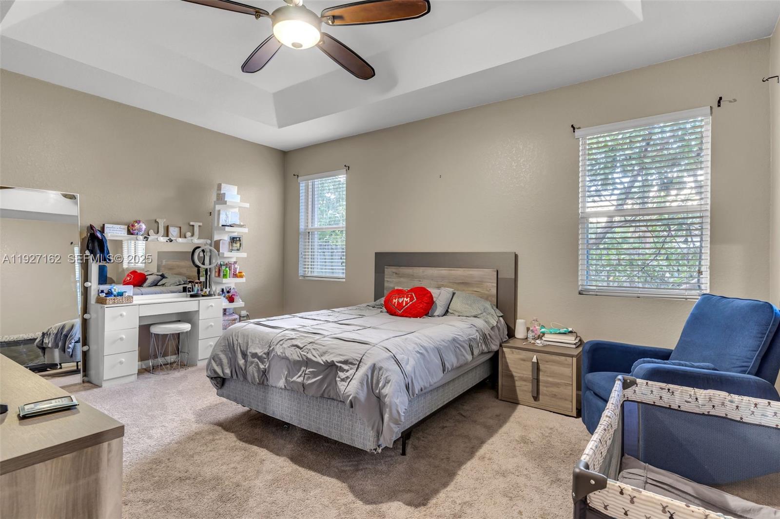 11833 Southwest 250th Terrace Homestead, FL 33032 - Photo 12 of 38 a bedroom with a bed and a couch