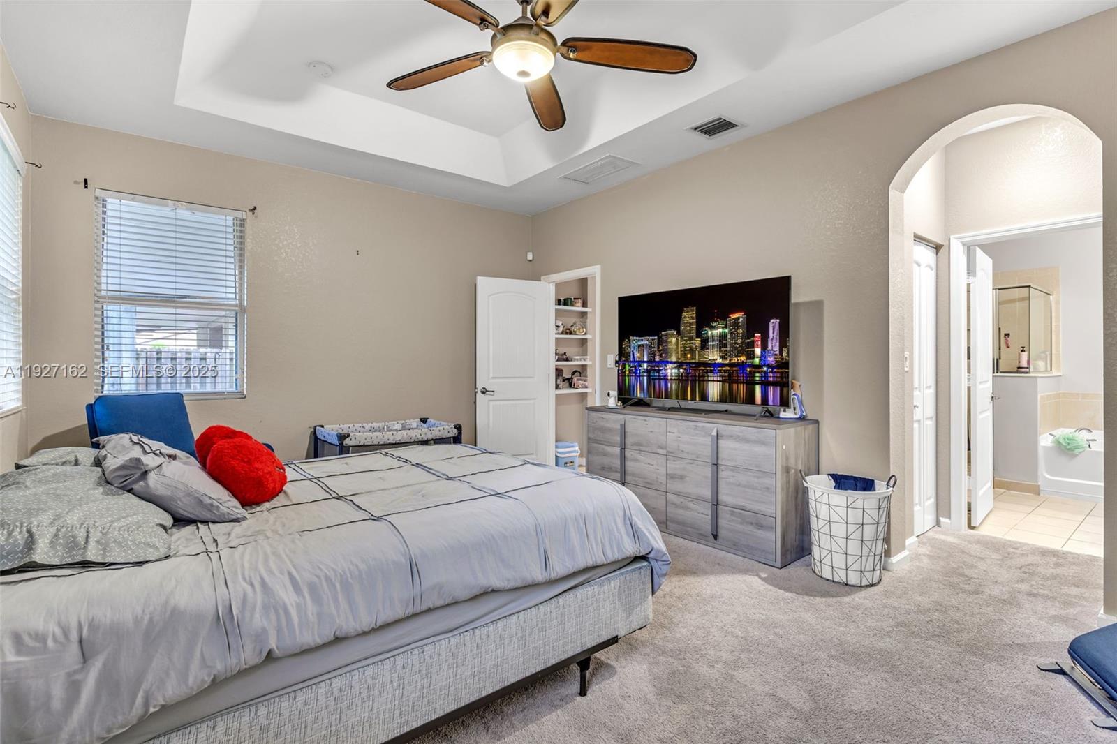 11833 Southwest 250th Terrace Homestead, FL 33032 - Photo 13 of 38 a bedroom with a bed and a flat screen tv