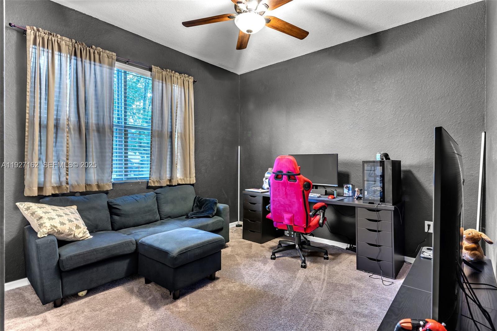 11833 Southwest 250th Terrace Homestead, FL 33032 - Photo 17 of 38 a living room with furniture and a flat screen tv