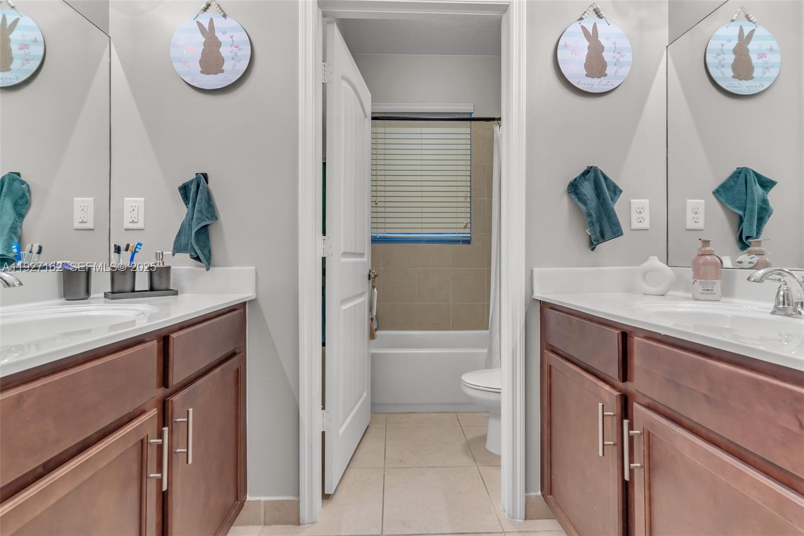 11833 Southwest 250th Terrace Homestead, FL 33032 - Photo 20 of 38 a bathroom with a sink a vanity and mirror