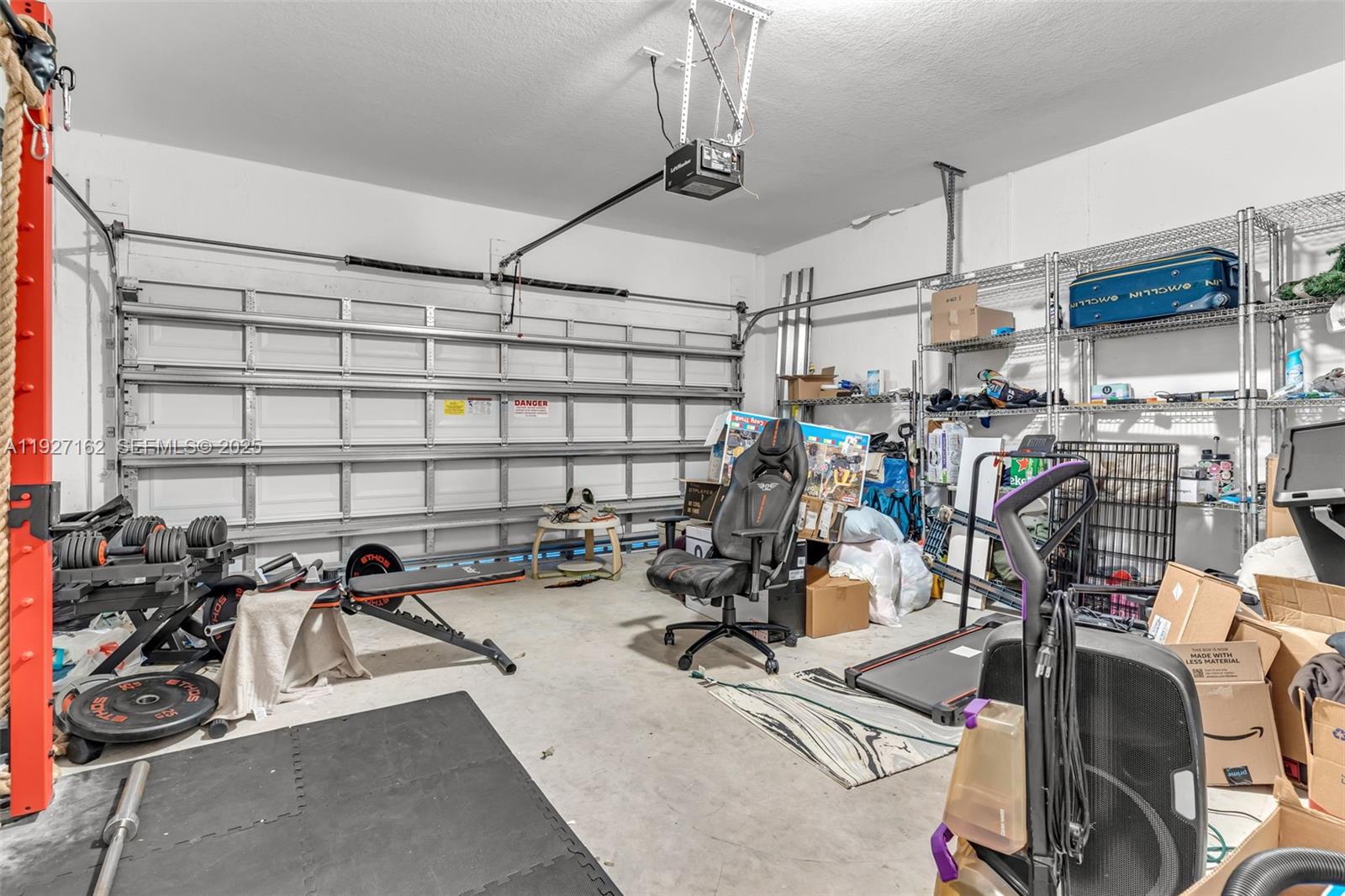 11833 Southwest 250th Terrace Homestead, FL 33032 - Photo 25 of 38 a view of a room with gym equipment