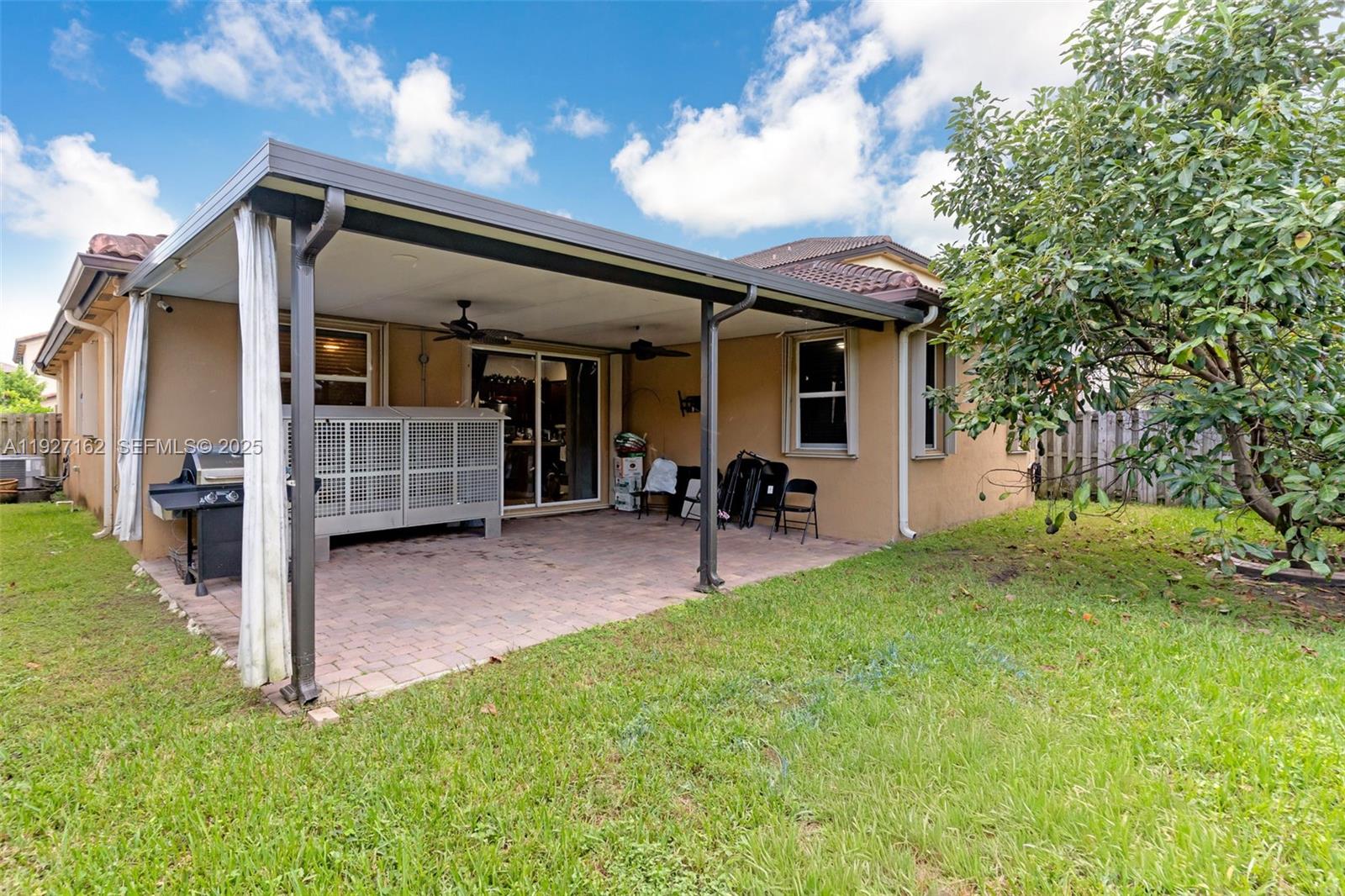 11833 Southwest 250th Terrace Homestead, FL 33032 - Photo 27 of 38 a view of a house with porch and garden