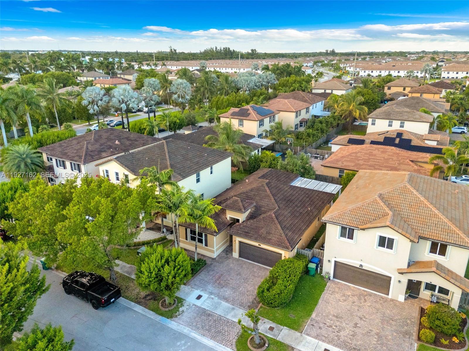11833 Southwest 250th Terrace Homestead, FL 33032 - Photo 31 of 38 an aerial view of residential houses with outdoor space