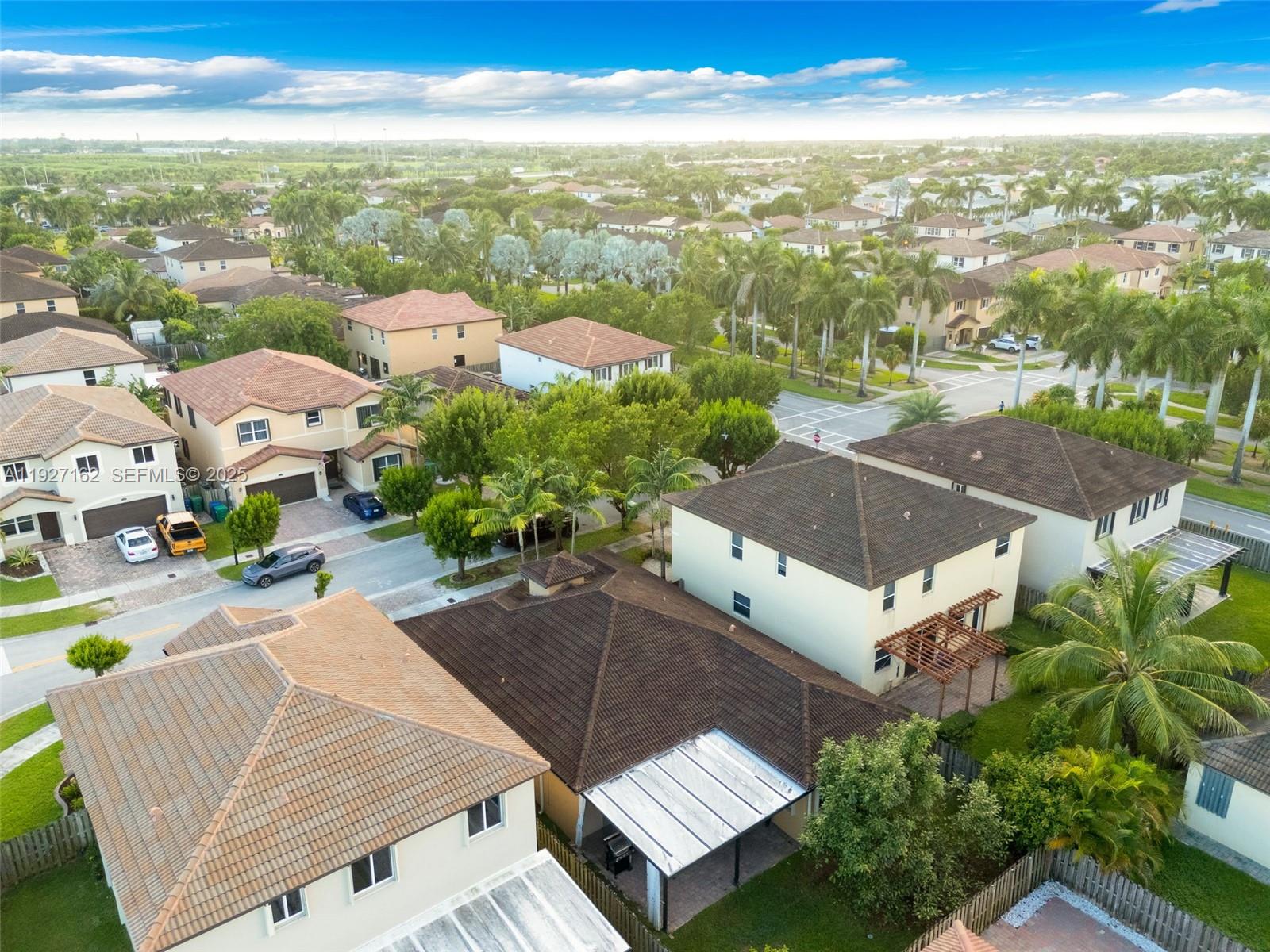 11833 Southwest 250th Terrace Homestead, FL 33032 - Photo 32 of 38 an aerial view of multiple house