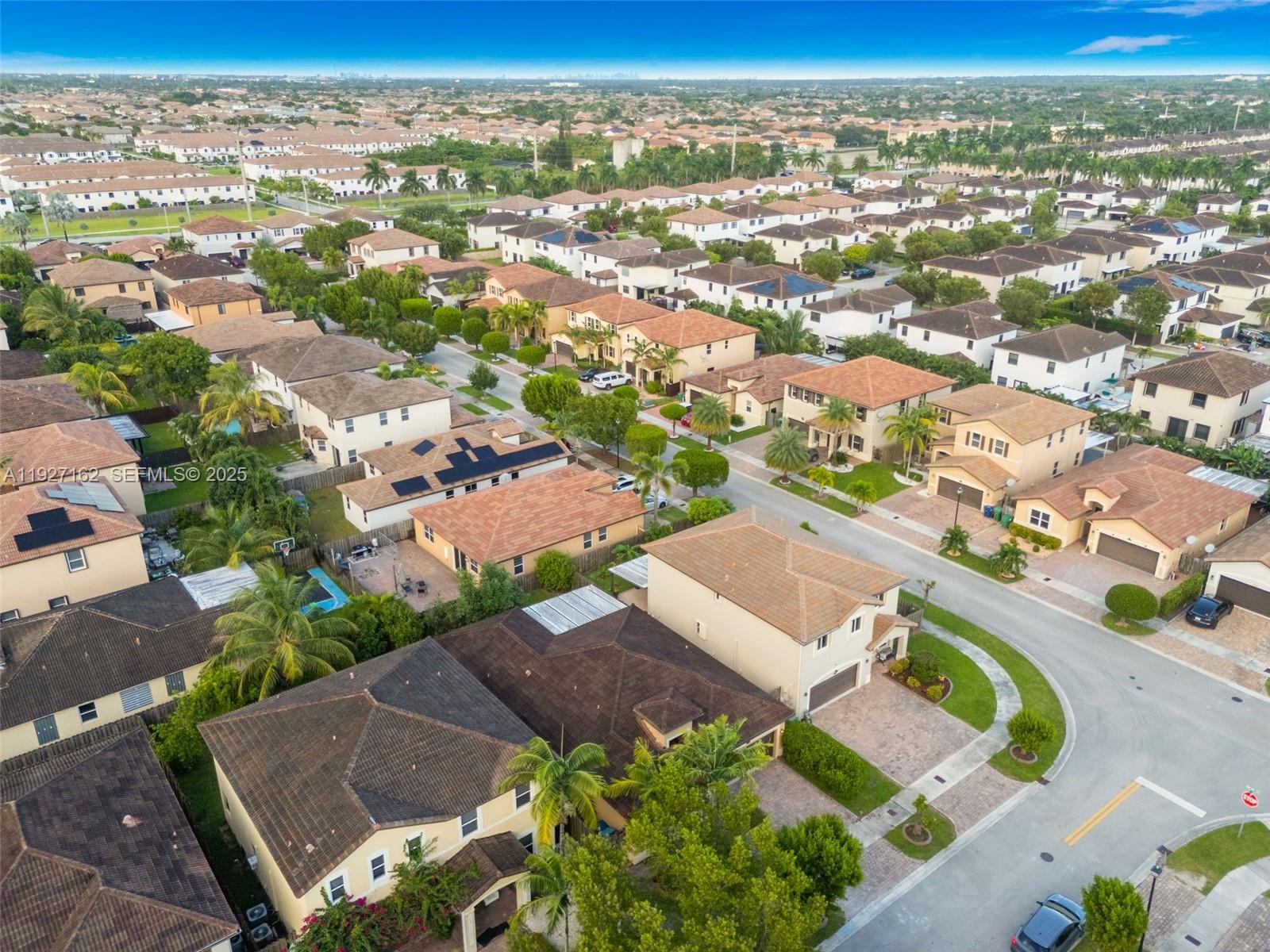 11833 Southwest 250th Terrace Homestead, FL 33032 - Photo 35 of 38 an aerial view of residential houses with outdoor space
