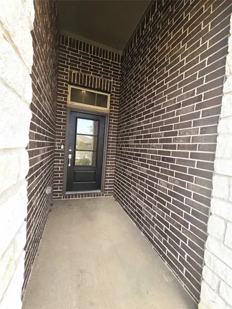 a view of an empty room with a fireplace