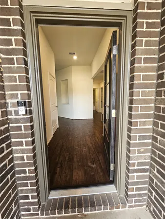 a view of a door and a window
