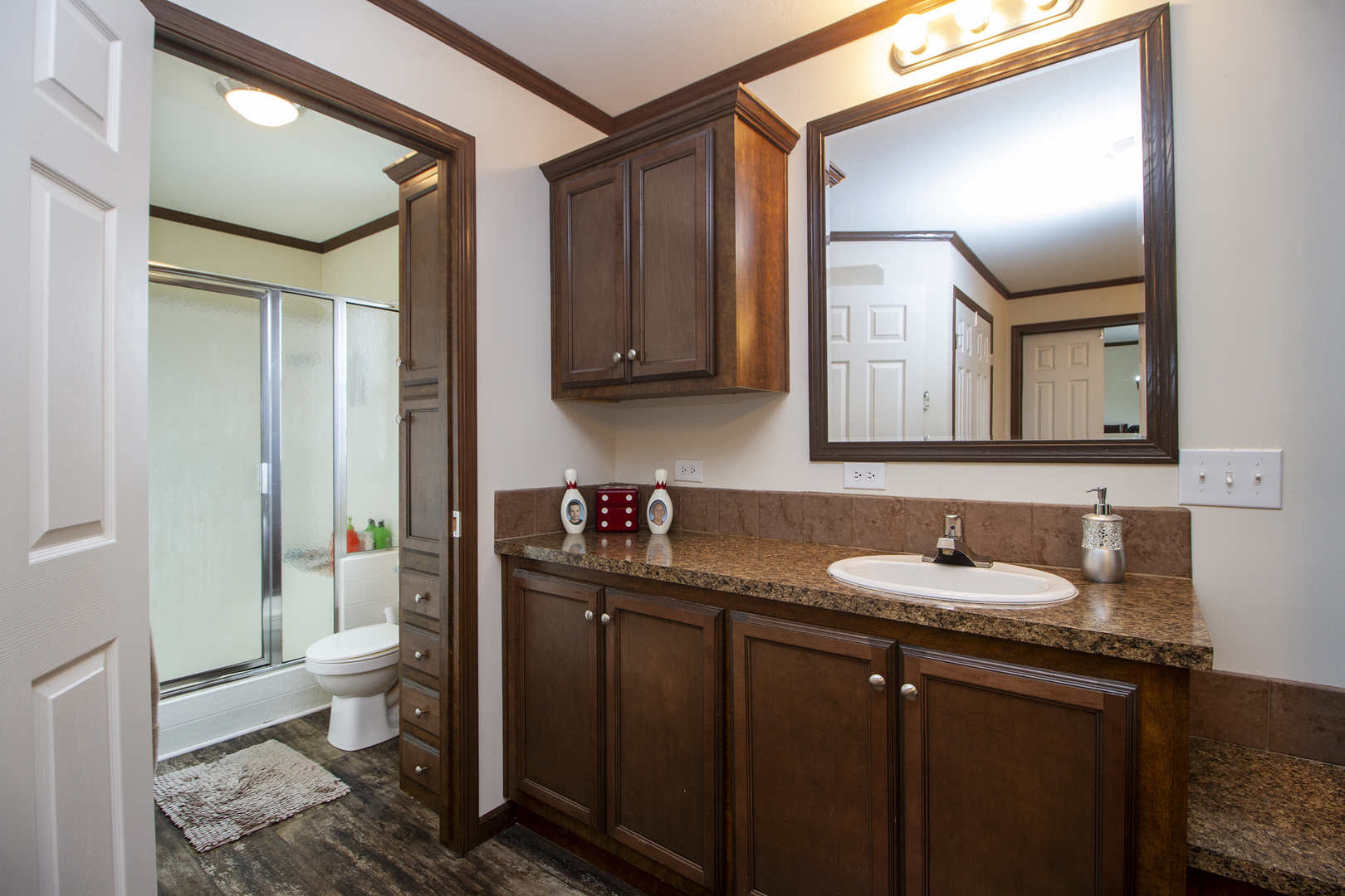 17 St Paul Bourbonnais, IL 60914 - Photo 12 of 16 a bathroom with a granite countertop sink toilet and mirror