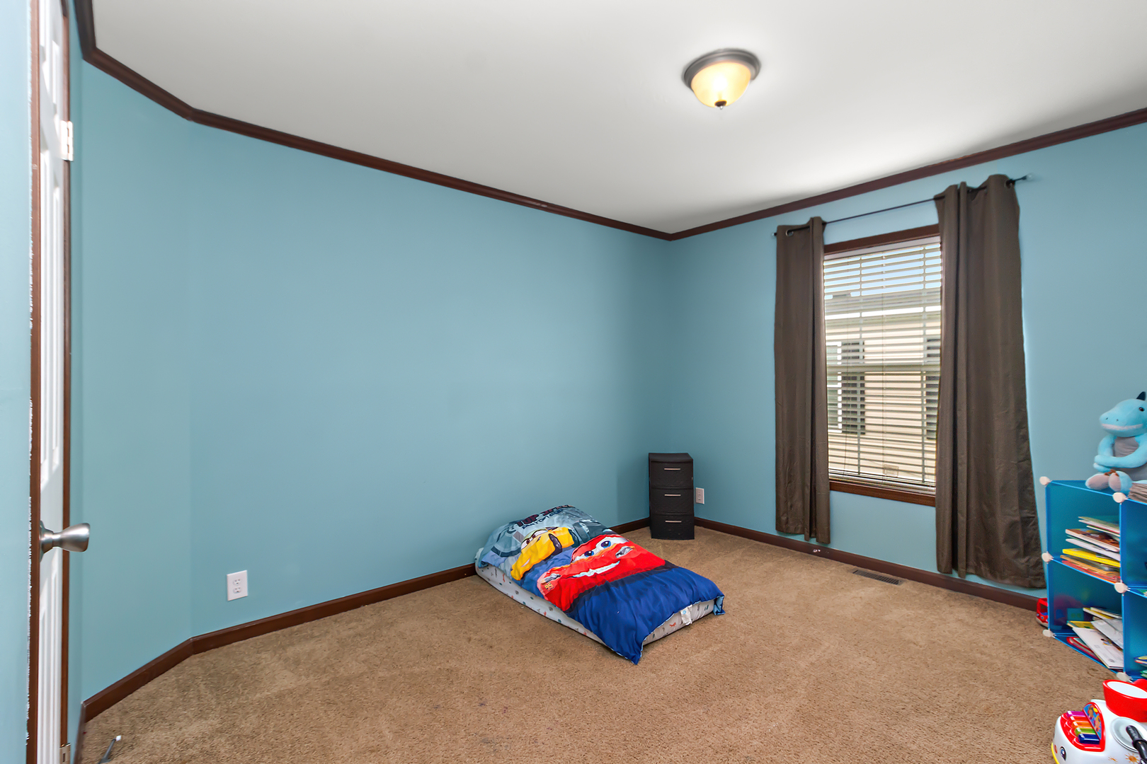 17 St Paul Bourbonnais, IL 60914 - Photo 13 of 16 an empty room with toys and dresser